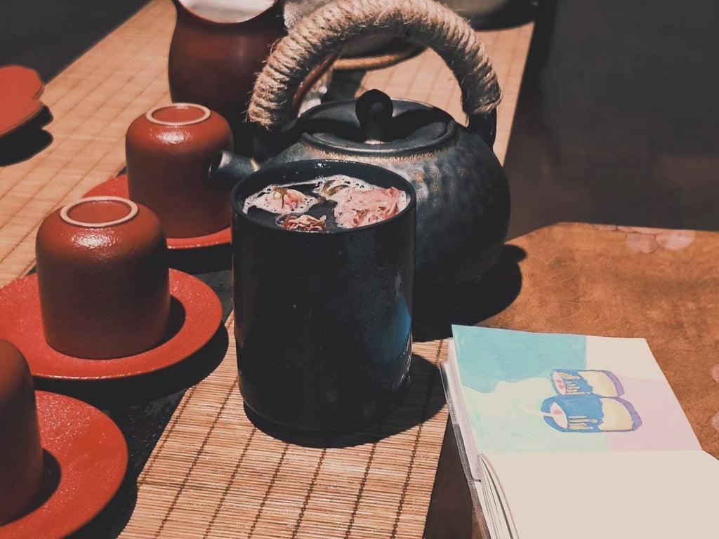 Relaxation Studio teaware set with iron teapot and red clay cups, perfect for tea and meditation rituals.